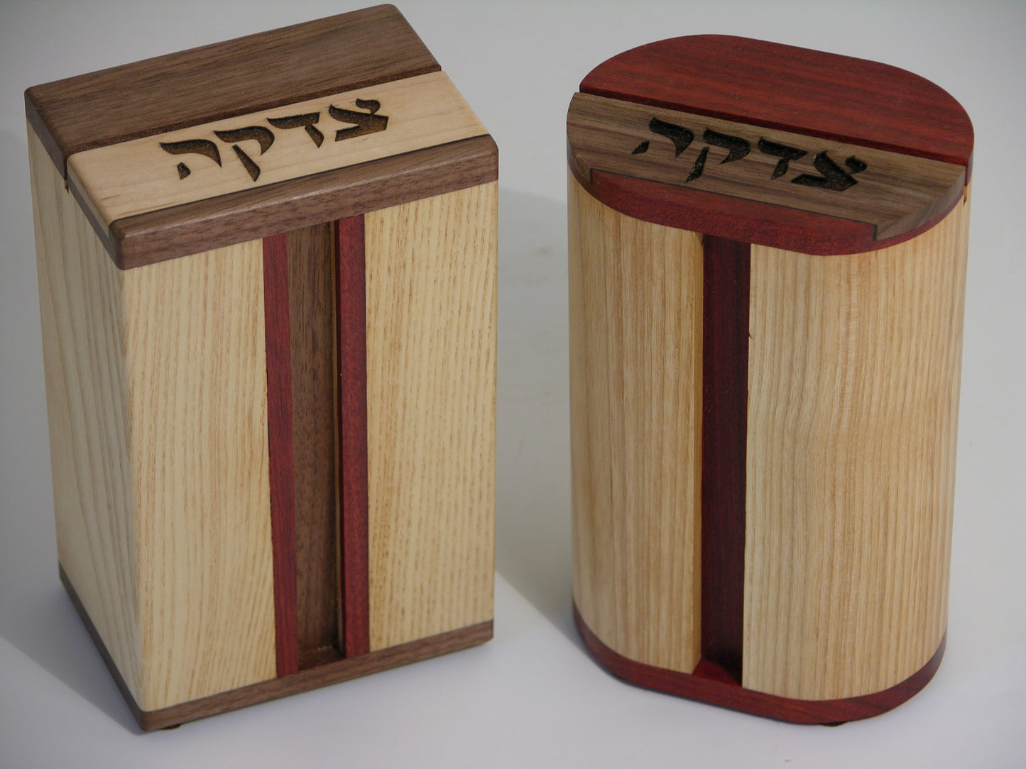 Tzedakah Boxes (EC18) featuring laser-engraved Hebrew text on premium hardwood with maple body and contrasting wood accents for religious giving.
