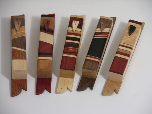 Set of five EC1 mezuzah cases, left to right: EC1B–EC1F in assorted hardwoods with carved wooden shins (made to order); detachable lid and 5.5-inch mounting backplate.