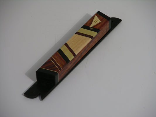 EC4 mezuzah case with cocobolo and ebony body, brass inlays, and a gold-plated shin; cavity fits up to a 3.25-inch parchment (scroll not included).