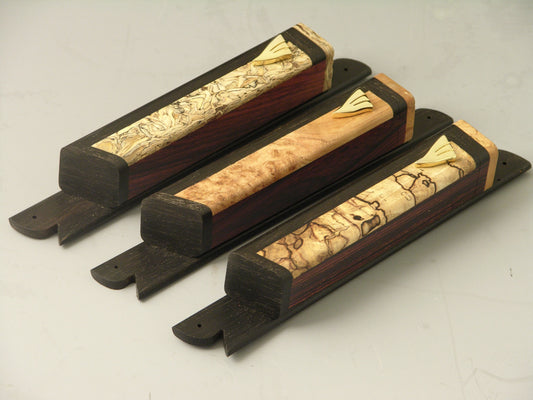 Mezuzah Cases (EC5) featuring handcrafted cocobolo wood bodies with gold plated shin symbols and ebony mounting bases, ideal for religious use.