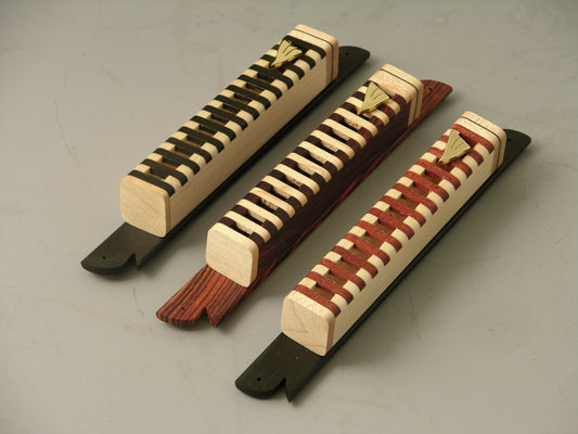 Mezuzah Cases (EC8) with handcrafted open grid design in natural wood tones, showcasing scroll visibility and mounted on decorative plates.
